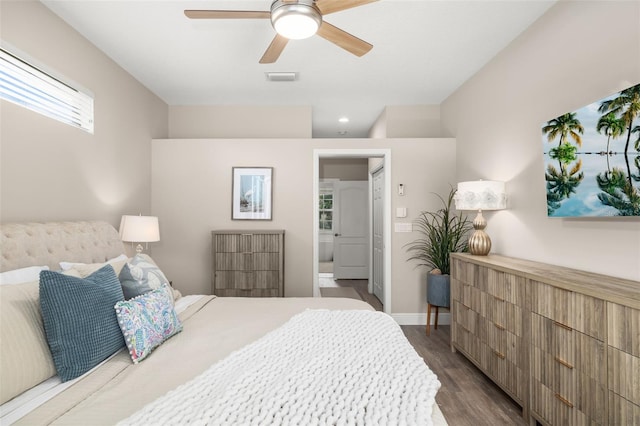 bedroom featuring a ceiling fan, dark wood finished floors, visible vents, and baseboards