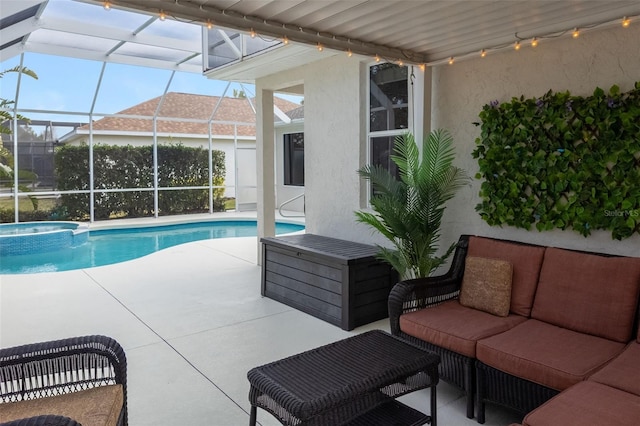 view of swimming pool featuring a pool with connected hot tub, a patio area, a lanai, and an outdoor hangout area