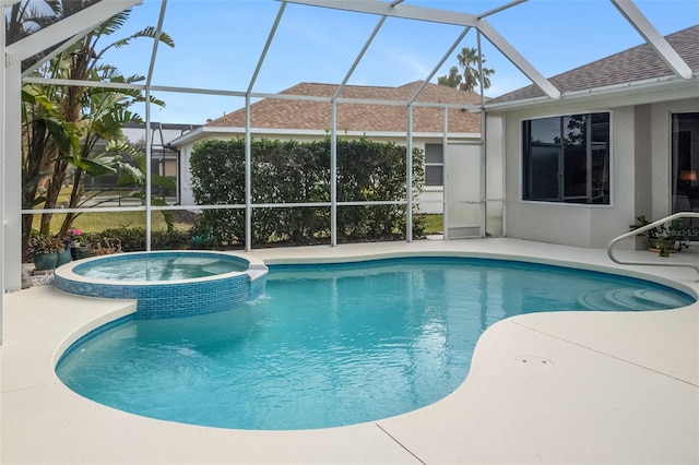 view of swimming pool with a patio area, a lanai, and a pool with connected hot tub