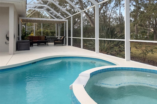 view of swimming pool featuring a lanai, a pool with connected hot tub, outdoor lounge area, and a patio