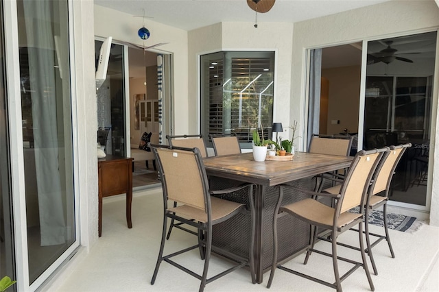 view of patio featuring a ceiling fan and outdoor dining space