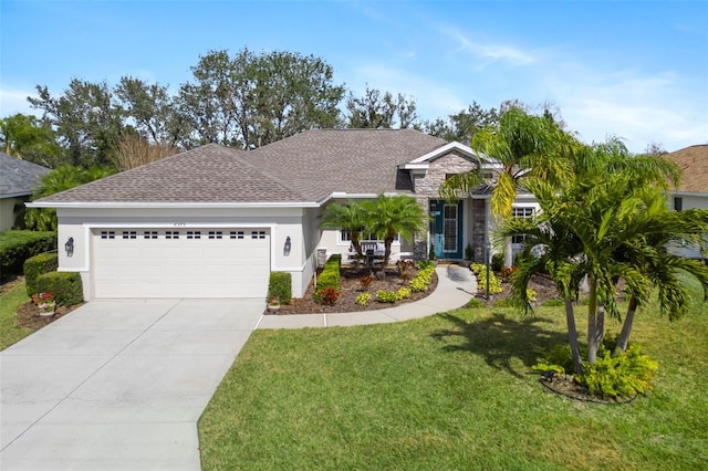 ranch-style home featuring stucco siding, a front yard, a garage, stone siding, and driveway