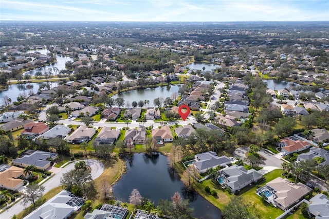 bird's eye view with a residential view and a water view