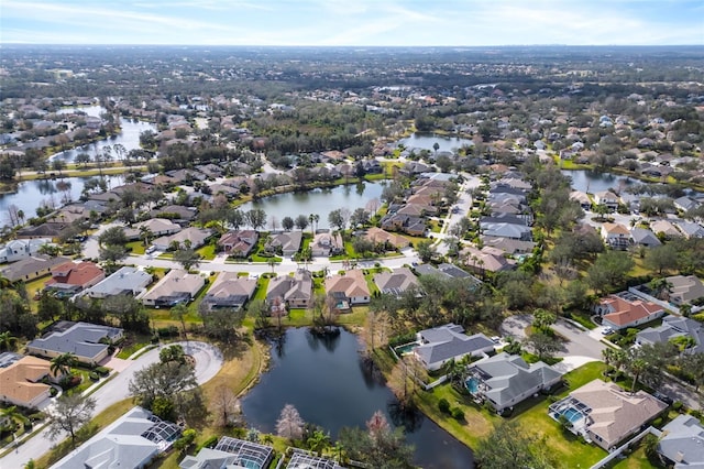 bird's eye view with a water view and a residential view