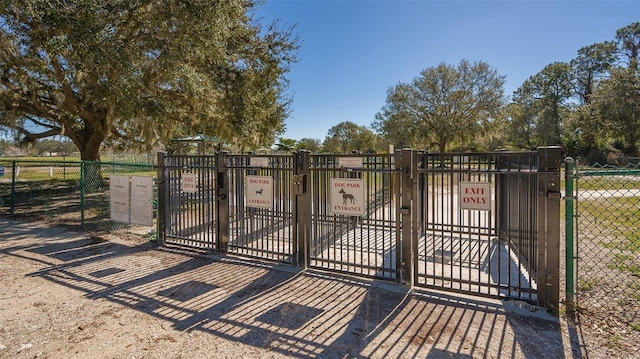 view of gate featuring fence