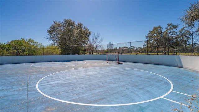 view of sport court with community basketball court and fence