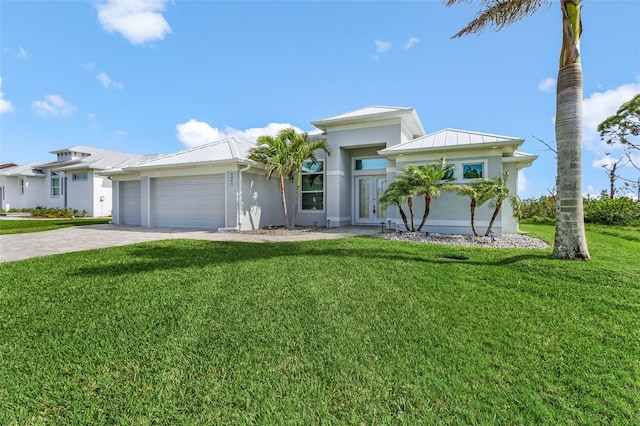 view of front of house featuring a garage and a front yard