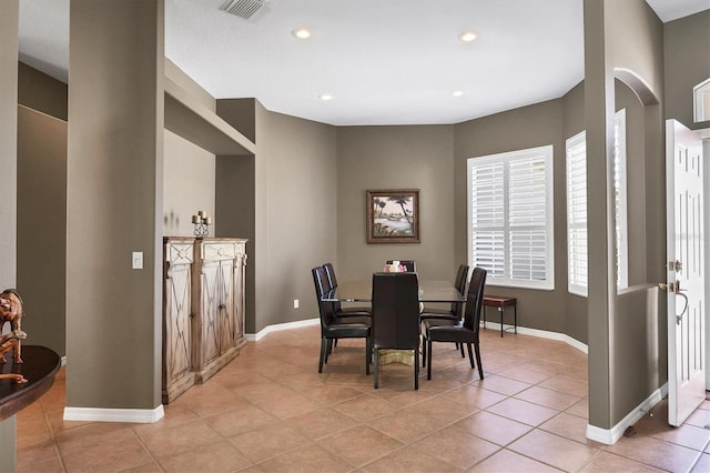 dining space with light tile patterned floors