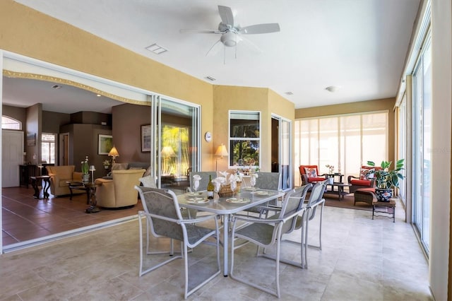 sunroom featuring ceiling fan