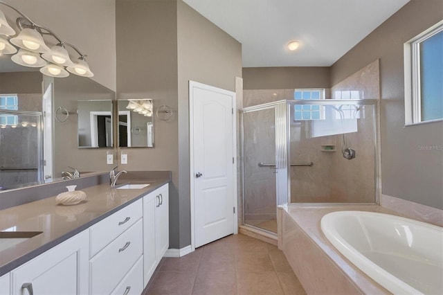 bathroom with tile patterned floors, independent shower and bath, and vanity