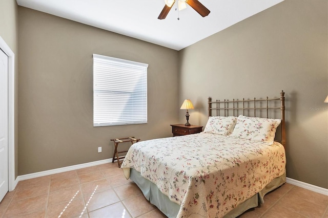 bedroom with light tile patterned floors and ceiling fan