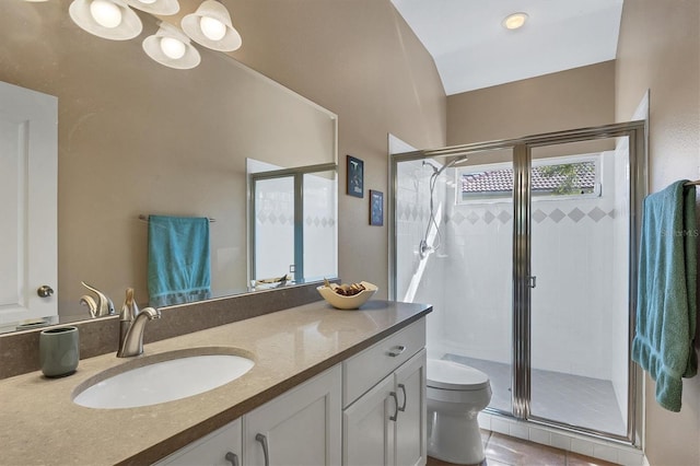 bathroom featuring vanity, an enclosed shower, tile patterned floors, and toilet