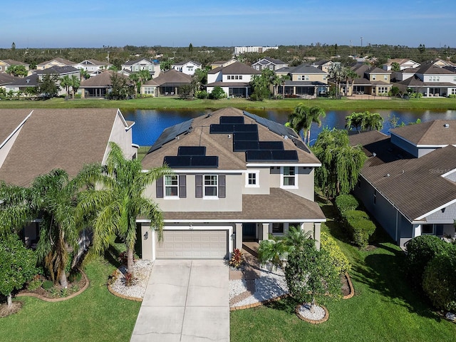 bird's eye view with a water view