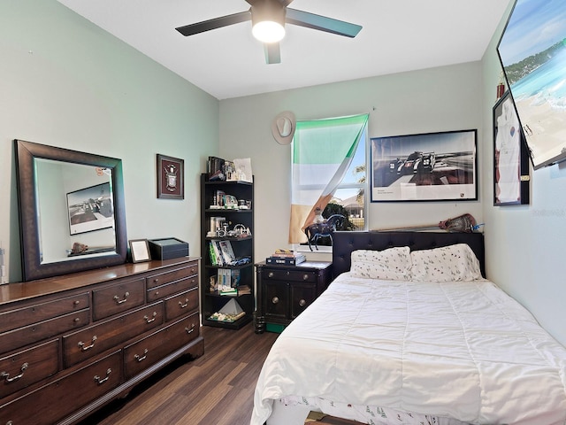 bedroom with dark wood-type flooring and a ceiling fan