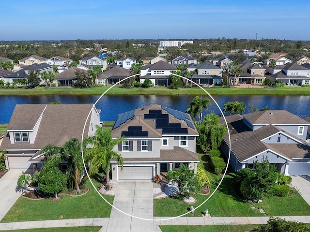 aerial view with a residential view and a water view