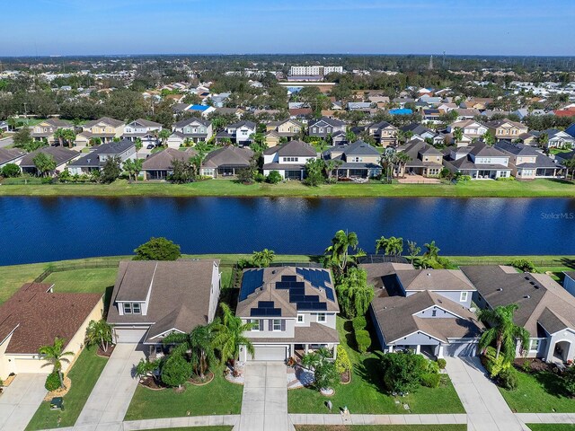 bird's eye view with a residential view and a water view