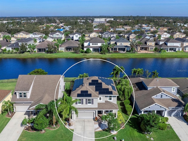 bird's eye view featuring a water view and a residential view