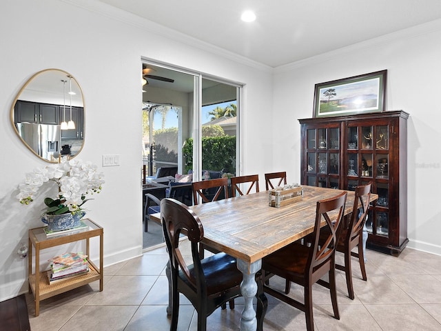 dining room with recessed lighting, crown molding, baseboards, and light tile patterned floors