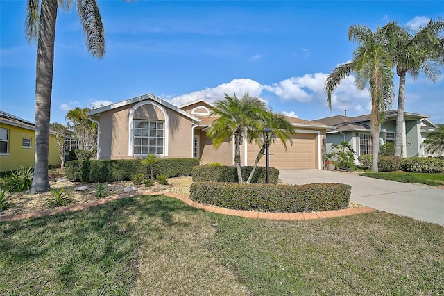 ranch-style home featuring a garage and a front yard