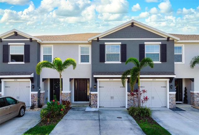 townhome / multi-family property featuring a garage