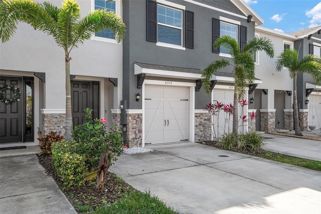 townhome / multi-family property featuring a garage