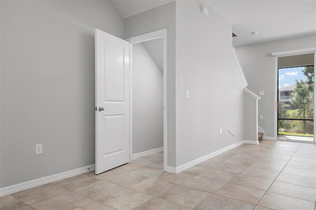 unfurnished room featuring light tile patterned flooring