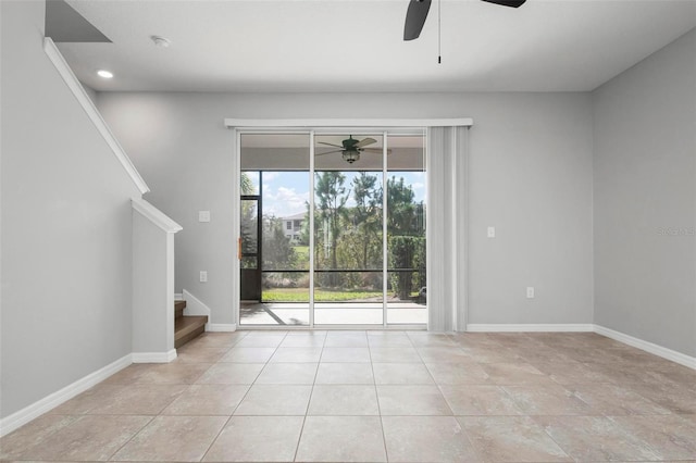 interior space with ceiling fan