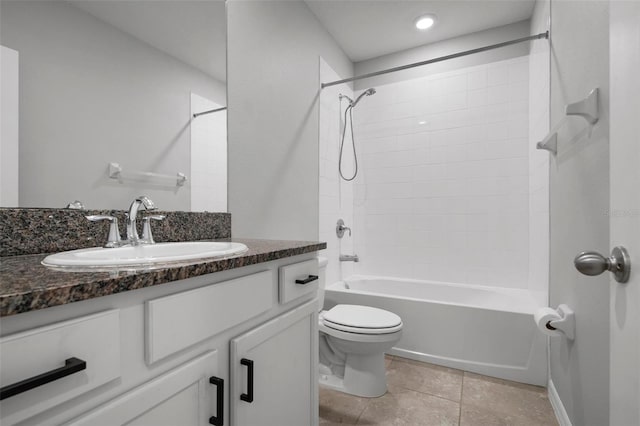 full bathroom featuring tile patterned flooring, vanity, toilet, and tiled shower / bath