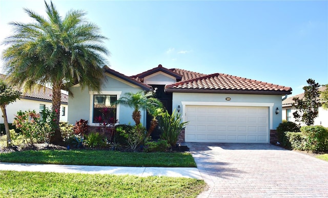 mediterranean / spanish-style home featuring a garage