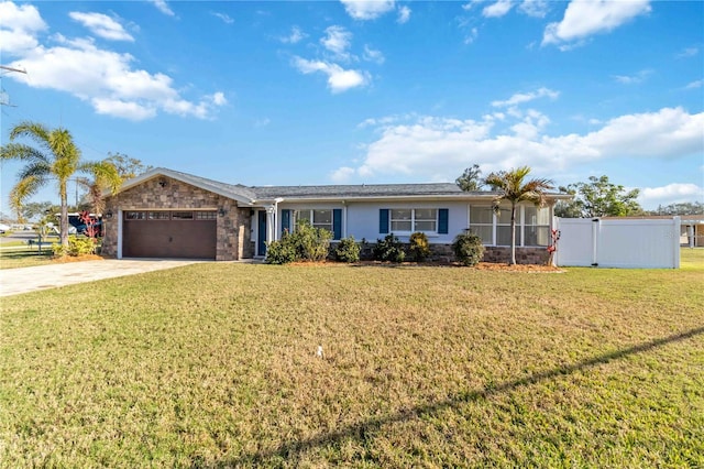 ranch-style house with a garage and a front lawn