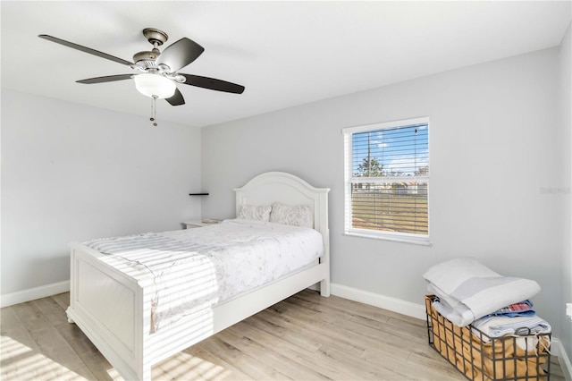 bedroom featuring ceiling fan and light wood-type flooring