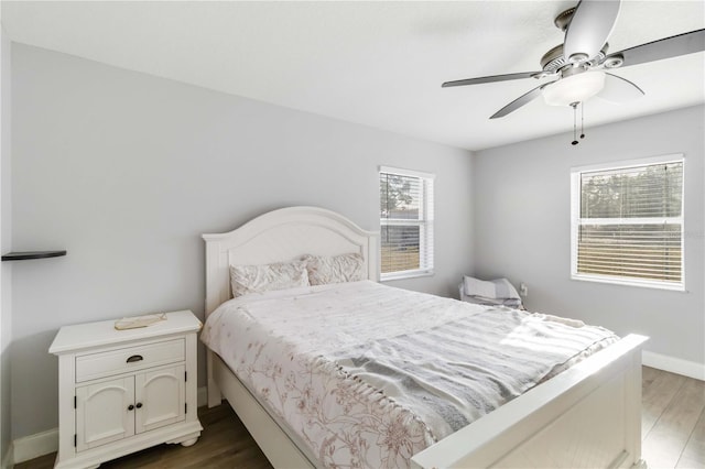 bedroom featuring dark hardwood / wood-style floors and ceiling fan