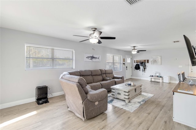 living room featuring ceiling fan and light wood-type flooring