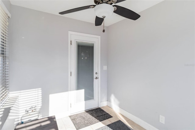 entrance to property featuring ceiling fan