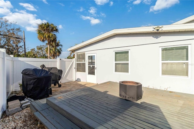 wooden terrace with area for grilling