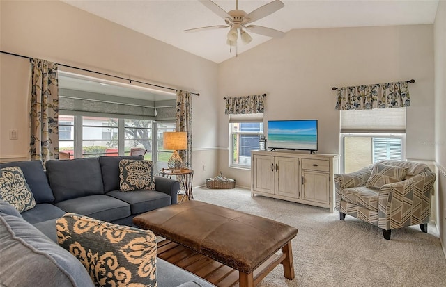 carpeted living room with lofted ceiling and ceiling fan