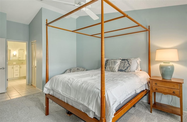 carpeted bedroom featuring ensuite bath