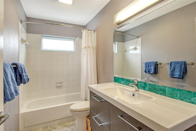 full bathroom featuring shower / tub combo with curtain, vanity, toilet, and tile patterned floors