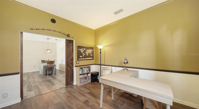 interior space featuring hardwood / wood-style flooring and ornamental molding