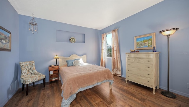 bedroom featuring dark wood-type flooring