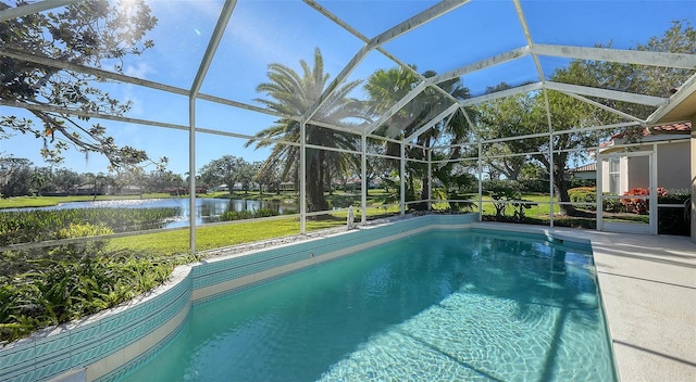 view of pool with a lanai, a patio, and a water view