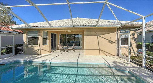 back of property featuring a lanai, a patio, and ceiling fan