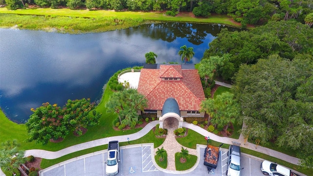 birds eye view of property with a water view