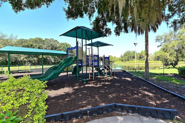 view of jungle gym featuring a water view