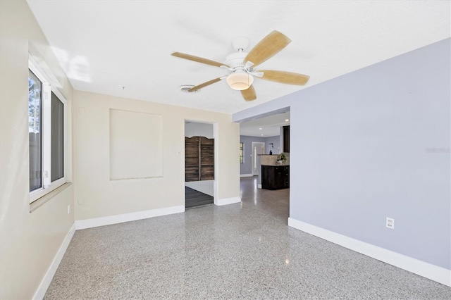 unfurnished room featuring ceiling fan