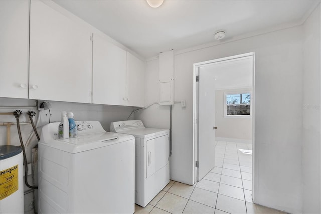 laundry room with washer and dryer, gas water heater, cabinets, and light tile patterned flooring