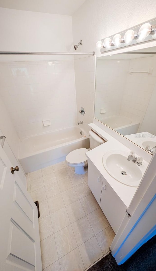 full bathroom featuring vanity, toilet, bathing tub / shower combination, and tile patterned flooring