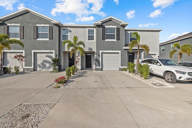 townhome / multi-family property featuring a garage