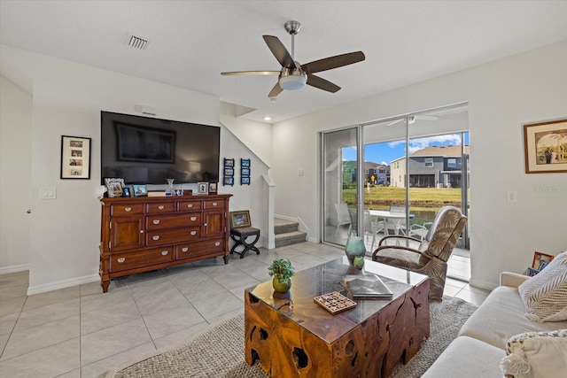 tiled living room with ceiling fan