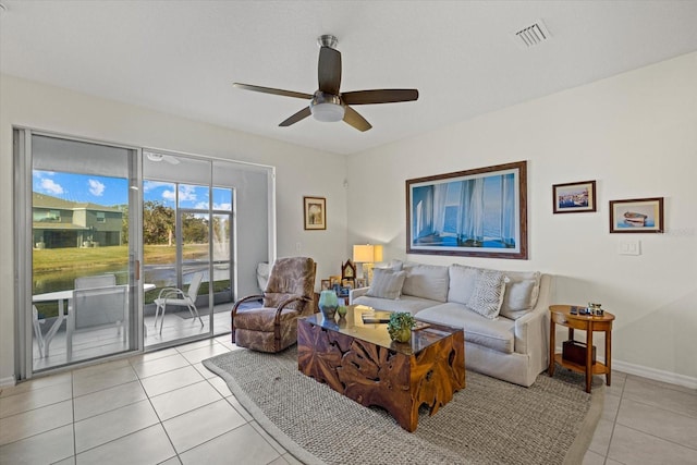 living room featuring ceiling fan and light tile patterned floors